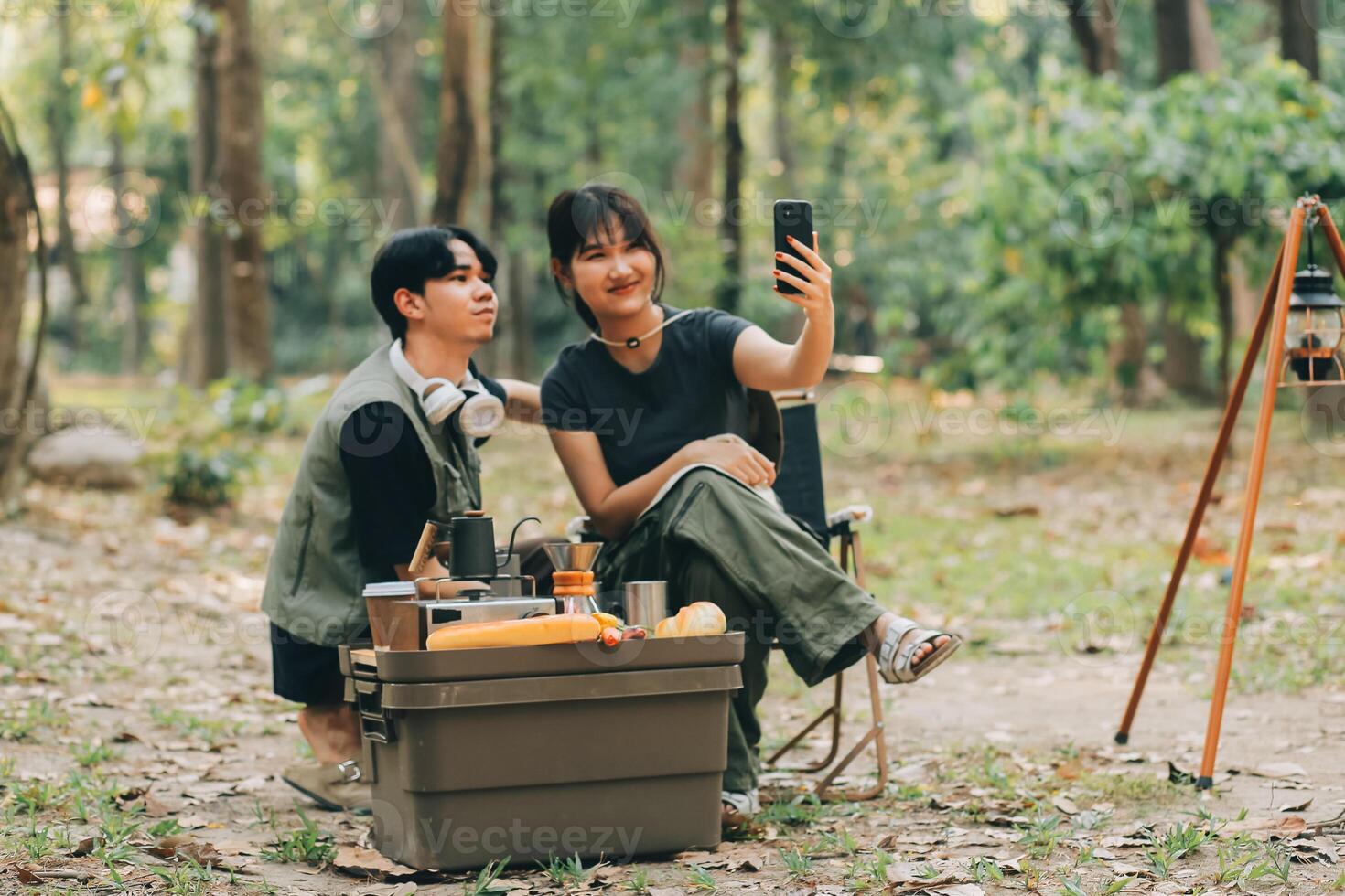 Asian couple sweet in tent inside on they camping trip, traveller relax and sleep togather in out door and camping trip photo
