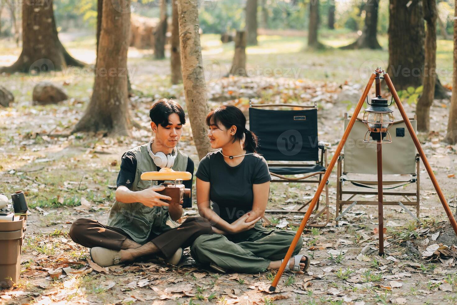 Asian couple sweet in tent inside on they camping trip, traveller relax and sleep togather in out door and camping trip photo