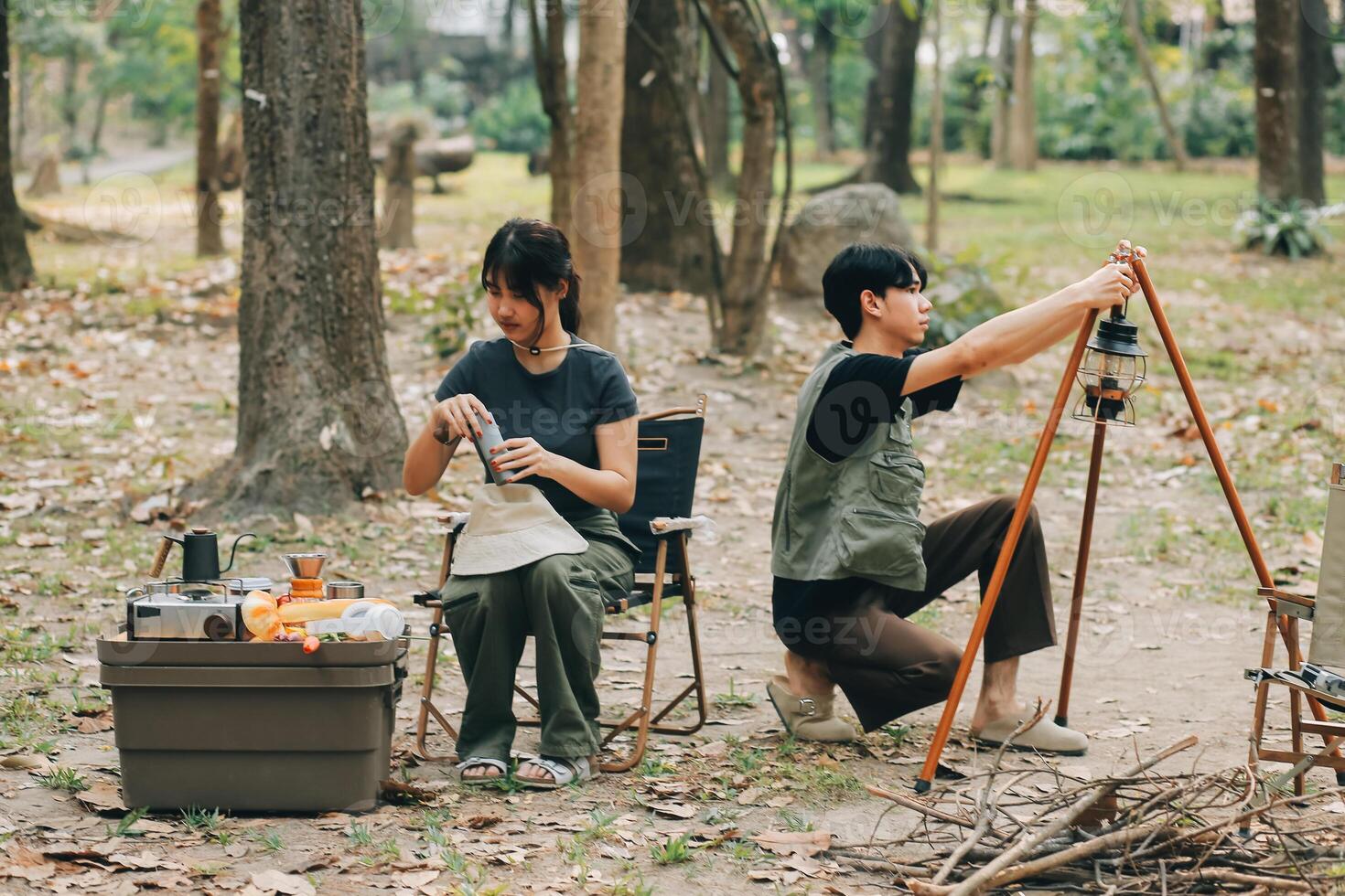 Asian couple sweet in tent inside on they camping trip, traveller relax and sleep togather in out door and camping trip photo