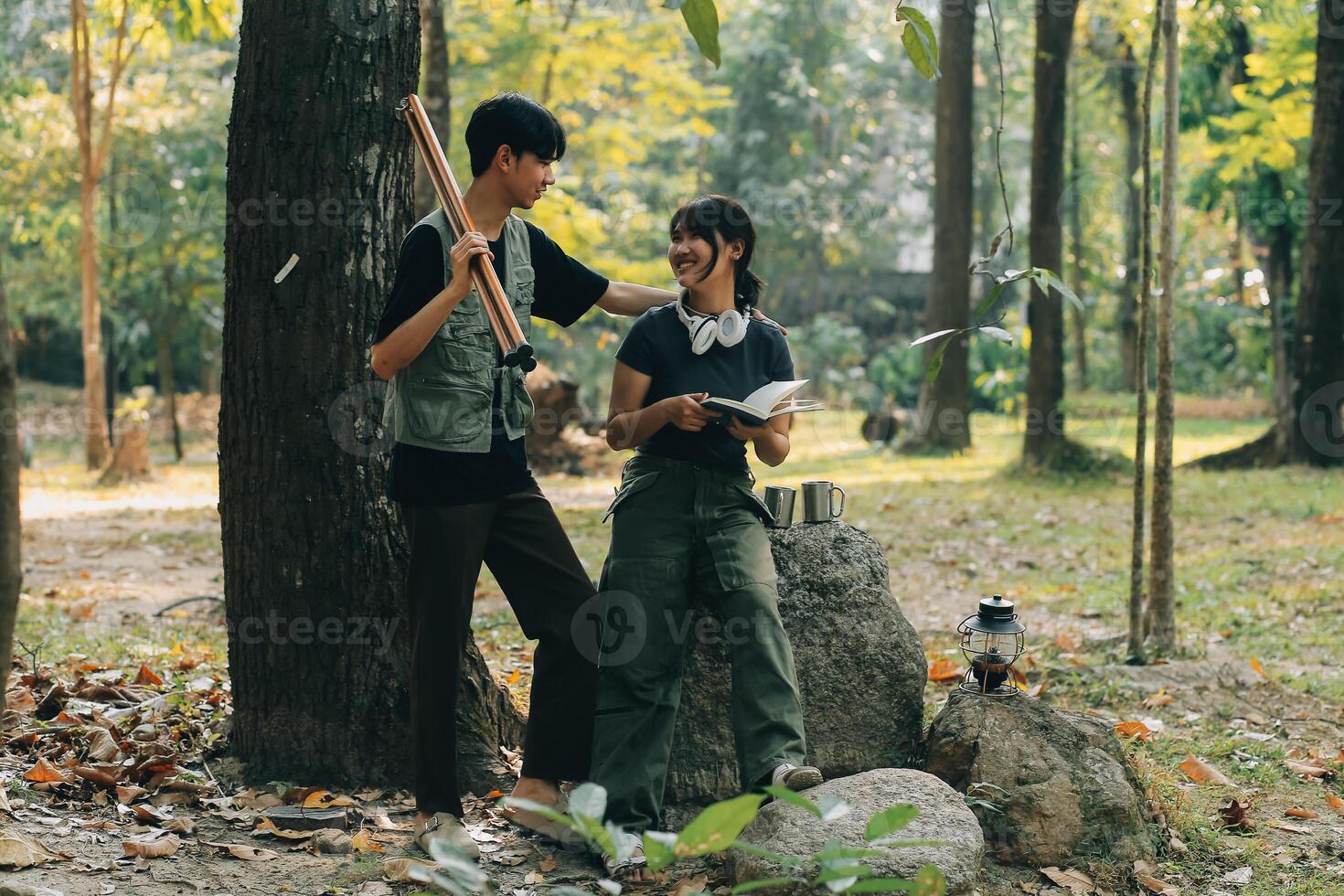 Asian couple sweet in tent inside on they camping trip, traveller relax and sleep togather in out door and camping trip photo