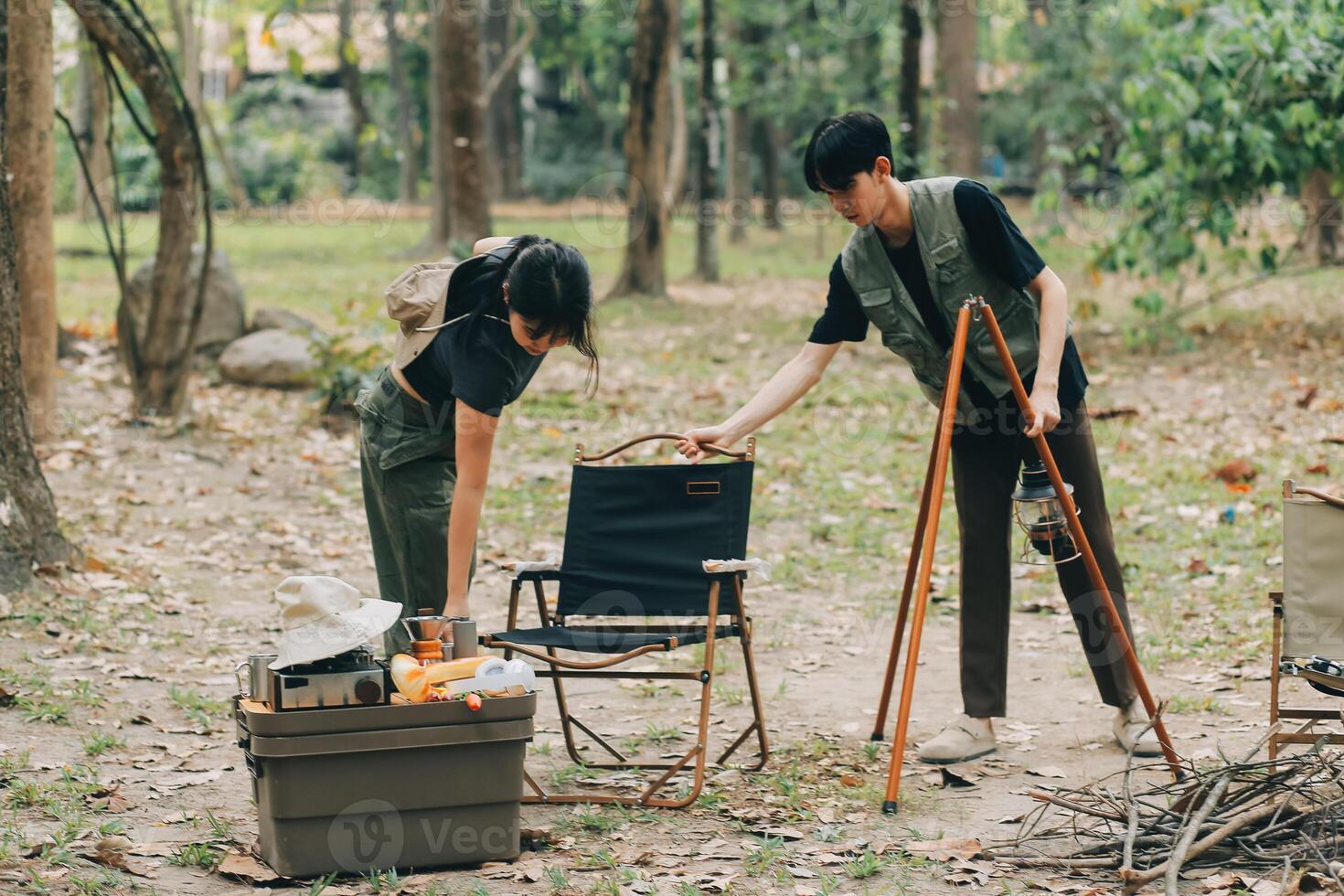 Asian couple sweet in tent inside on they camping trip, traveller relax and sleep togather in out door and camping trip photo