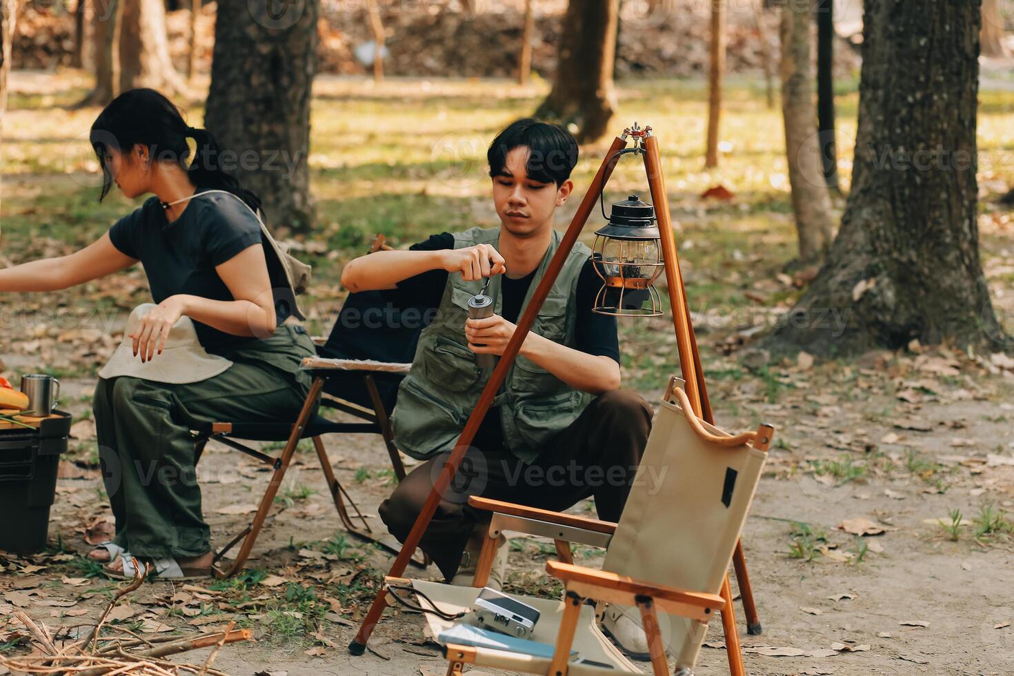 Asian couple sweet in tent inside on they camping trip, traveller relax and sleep togather in out door and camping trip photo