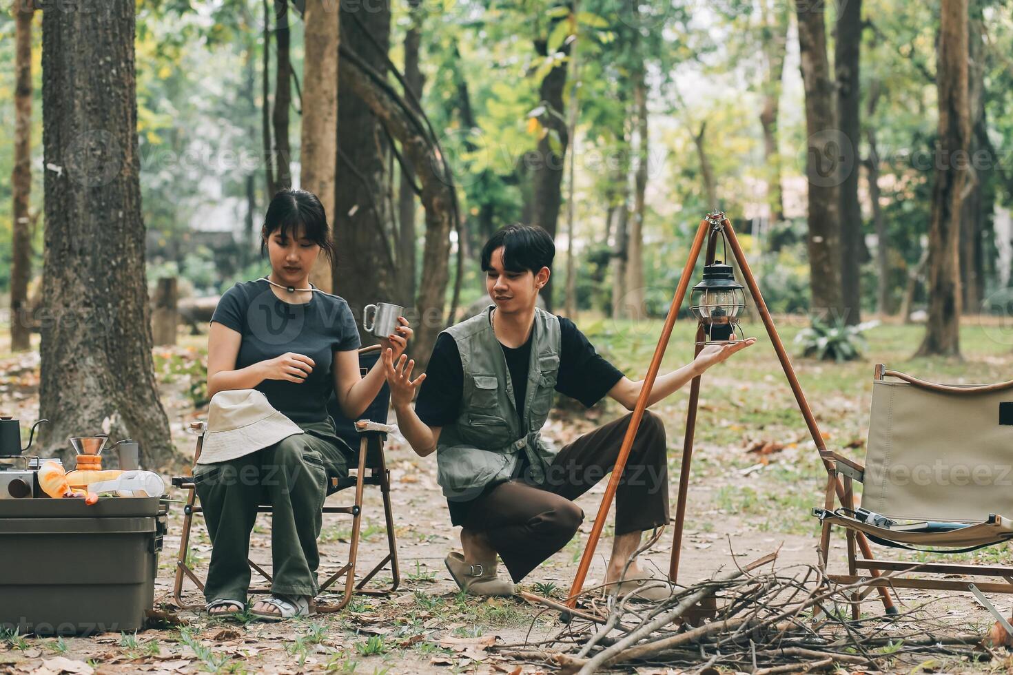 Asian couple sweet in tent inside on they camping trip, traveller relax and sleep togather in out door and camping trip photo
