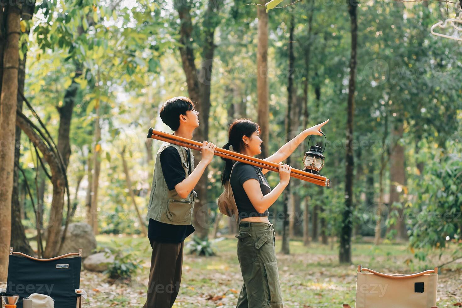 Asian couple sweet in tent inside on they camping trip, traveller relax and sleep togather in out door and camping trip photo