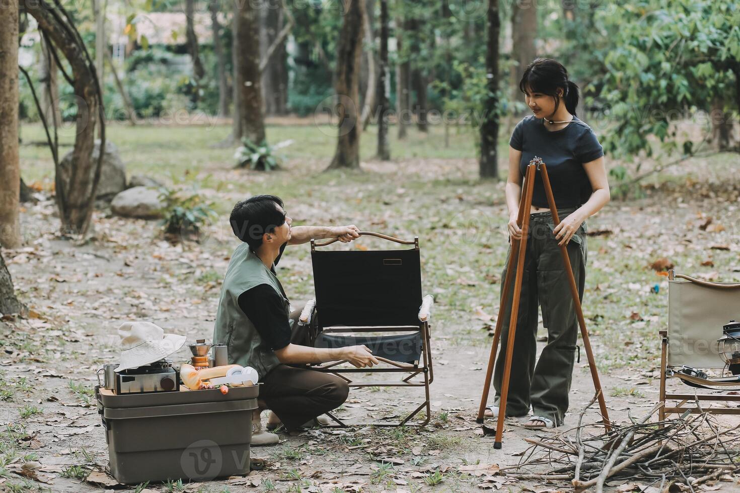 Asian couple sweet in tent inside on they camping trip, traveller relax and sleep togather in out door and camping trip photo