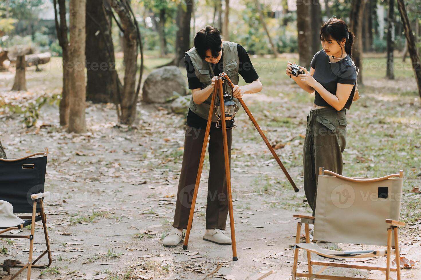 Asian couple sweet in tent inside on they camping trip, traveller relax and sleep togather in out door and camping trip photo