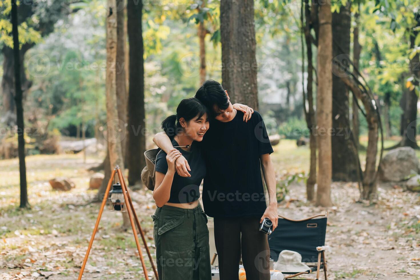 Asian couple sweet in tent inside on they camping trip, traveller relax and sleep togather in out door and camping trip photo