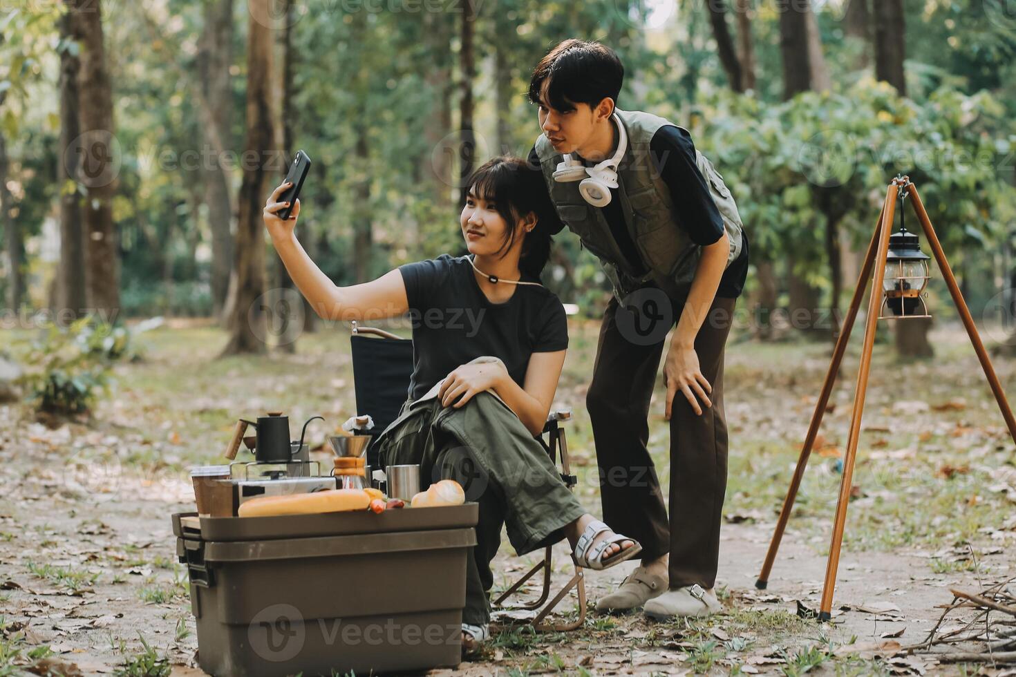 Asian couple sweet in tent inside on they camping trip, traveller relax and sleep togather in out door and camping trip photo