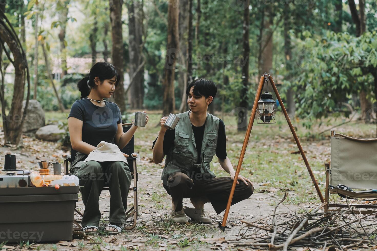 Asian couple sweet in tent inside on they camping trip, traveller relax and sleep togather in out door and camping trip photo