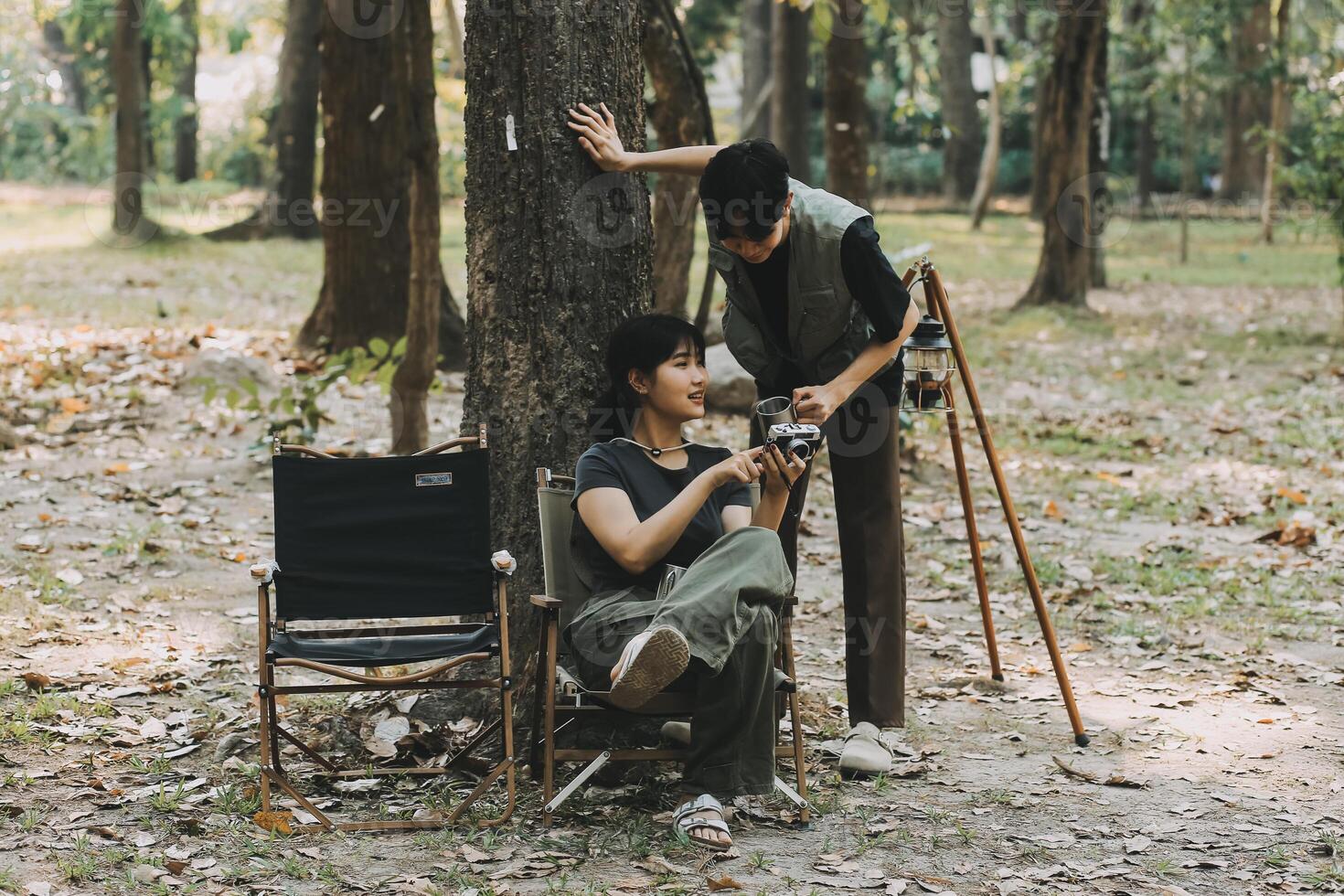 Asian couple sweet in tent inside on they camping trip, traveller relax and sleep togather in out door and camping trip photo
