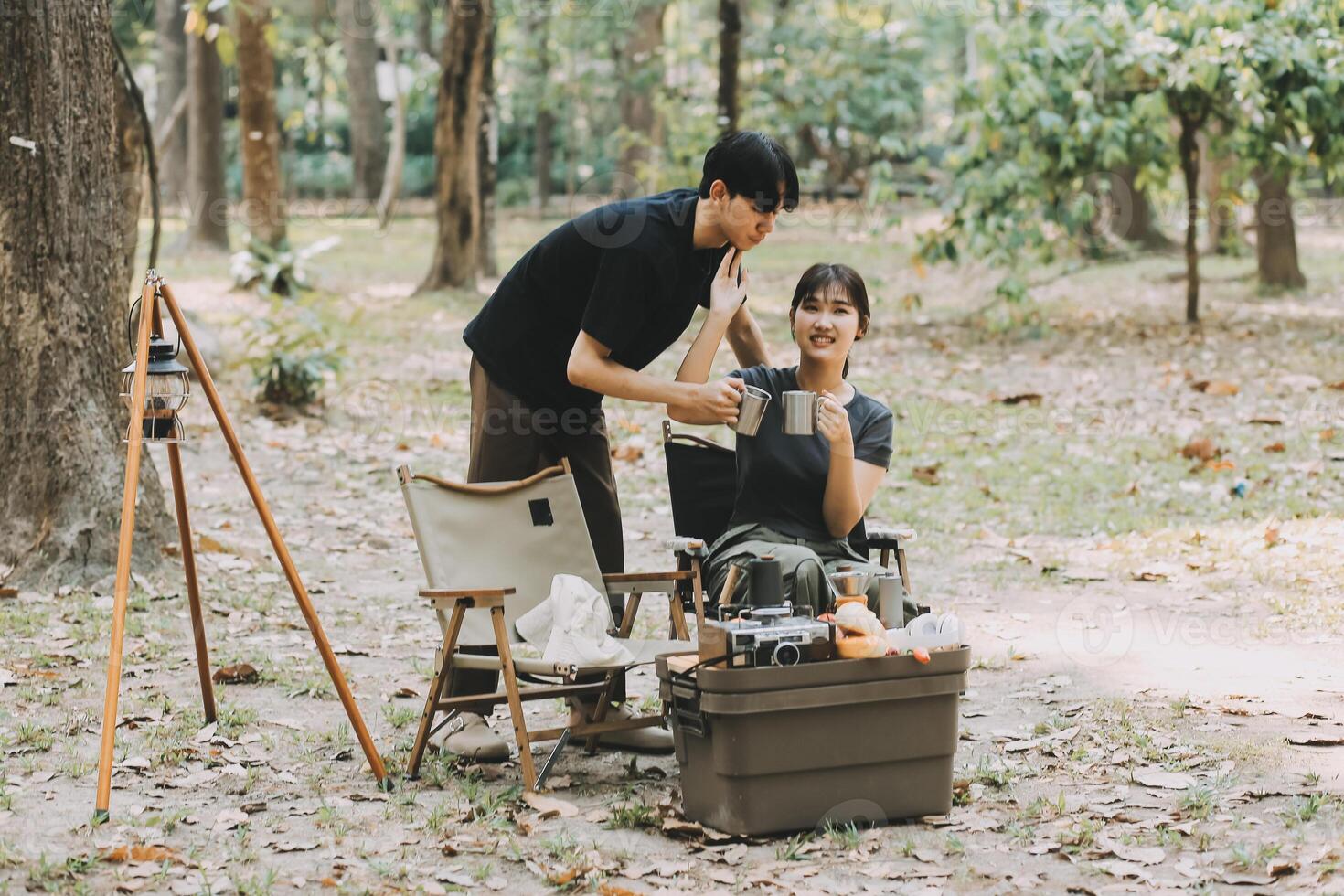 Asian couple sweet in tent inside on they camping trip, traveller relax and sleep togather in out door and camping trip photo