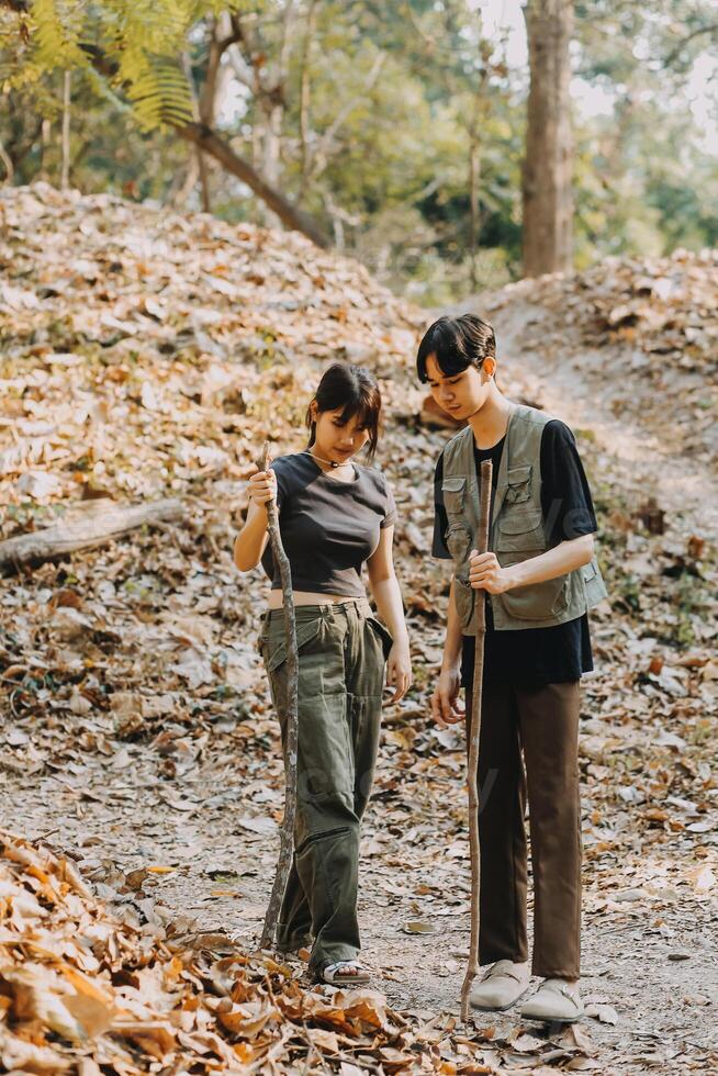 Asian couple sweet in tent inside on they camping trip, traveller relax and sleep togather in out door and camping trip photo