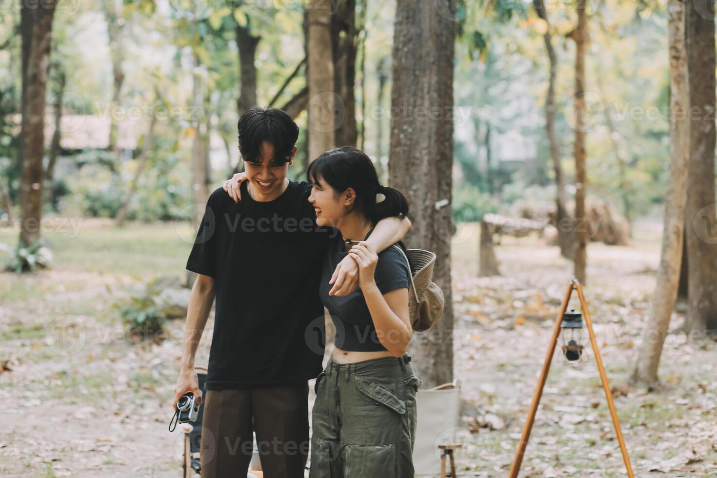 Asian couple sweet in tent inside on they camping trip, traveller relax and sleep togather in out door and camping trip photo