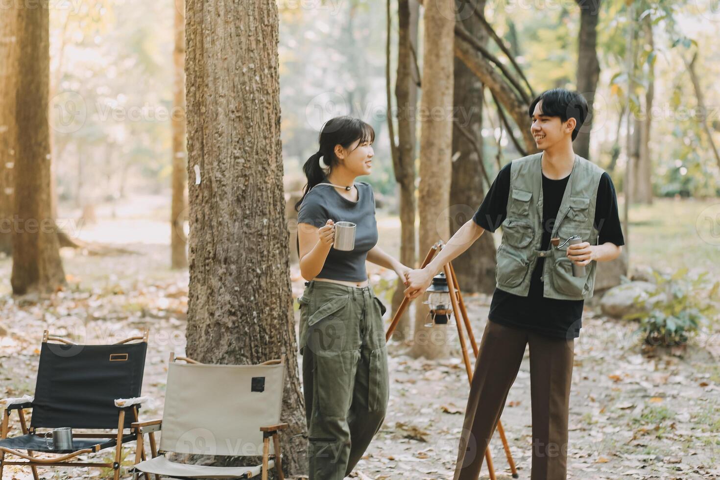 Asian couple sweet in tent inside on they camping trip, traveller relax and sleep togather in out door and camping trip photo