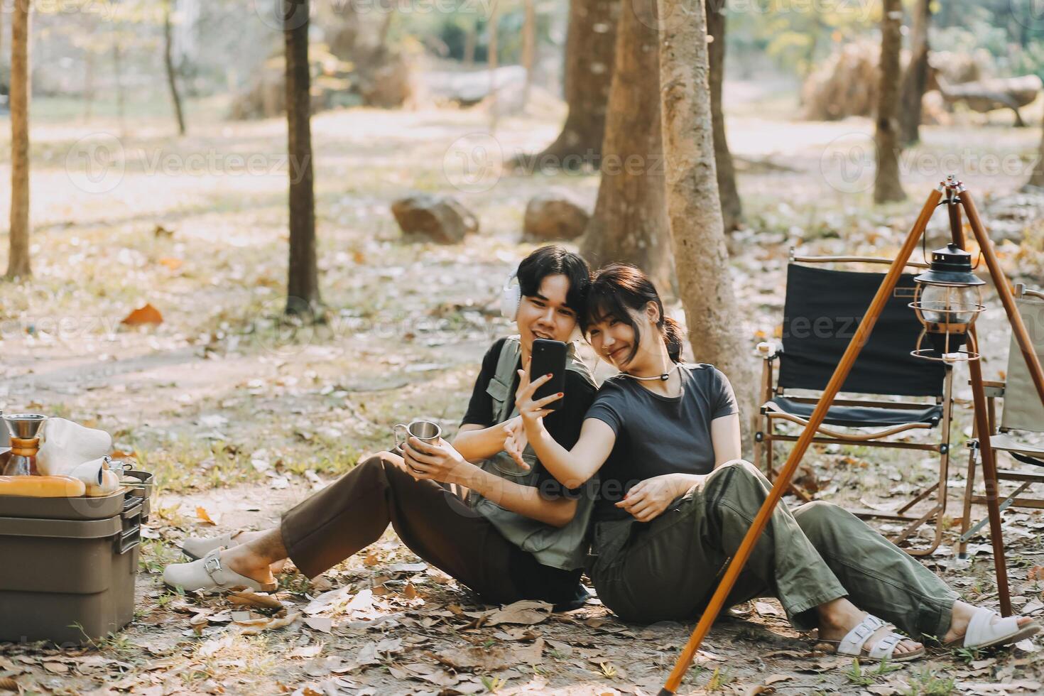 Asian couple sweet in tent inside on they camping trip, traveller relax and sleep togather in out door and camping trip photo
