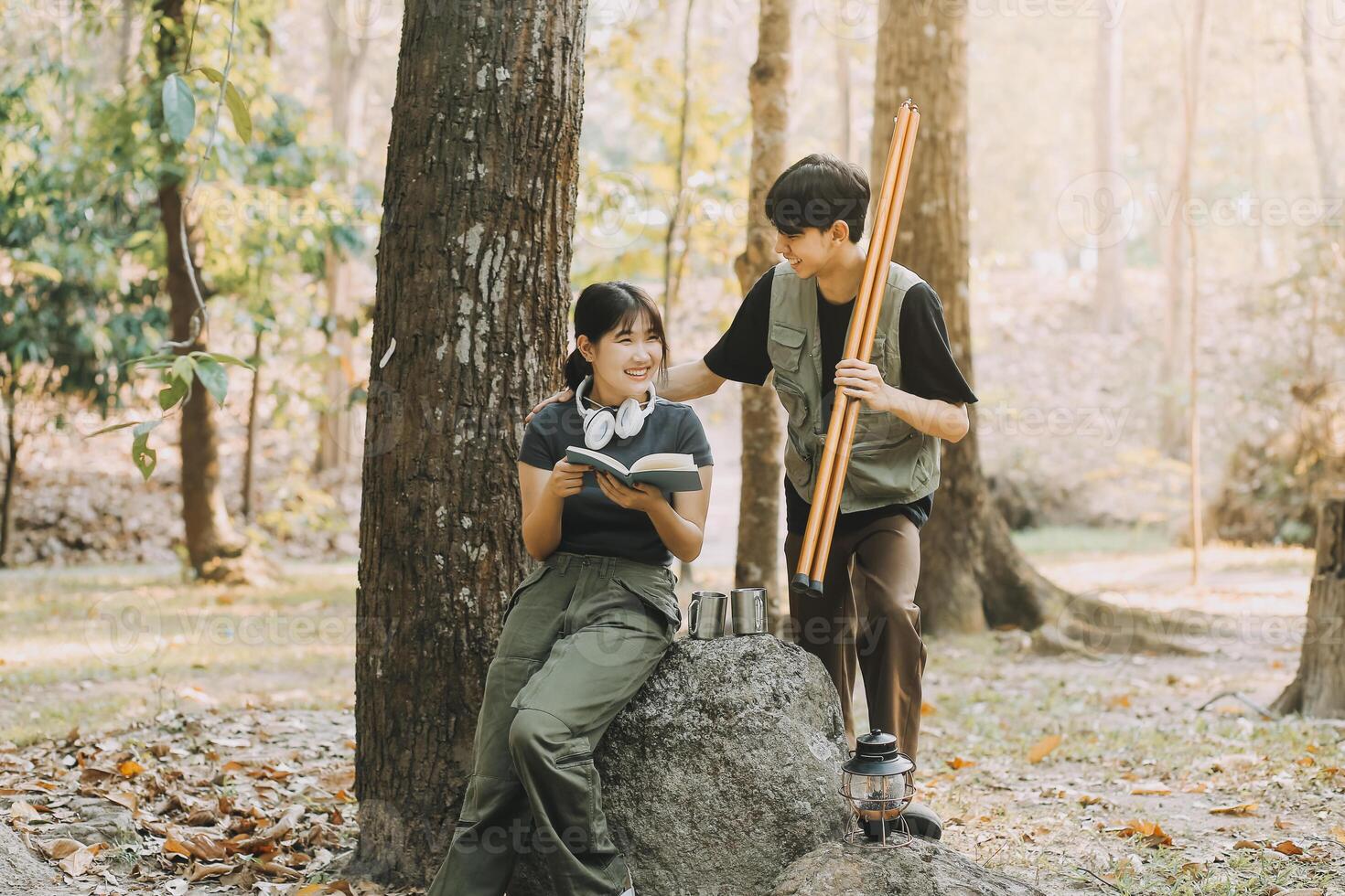 Asian couple sweet in tent inside on they camping trip, traveller relax and sleep togather in out door and camping trip photo