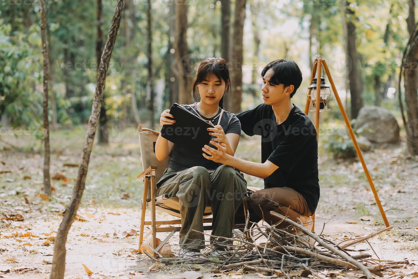 Asian couple sweet in tent inside on they camping trip, traveller relax and sleep togather in out door and camping trip photo