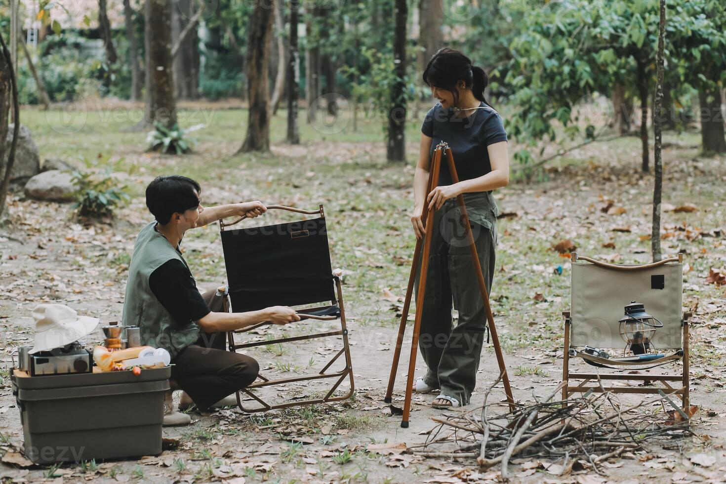 Asian couple sweet in tent inside on they camping trip, traveller relax and sleep togather in out door and camping trip photo