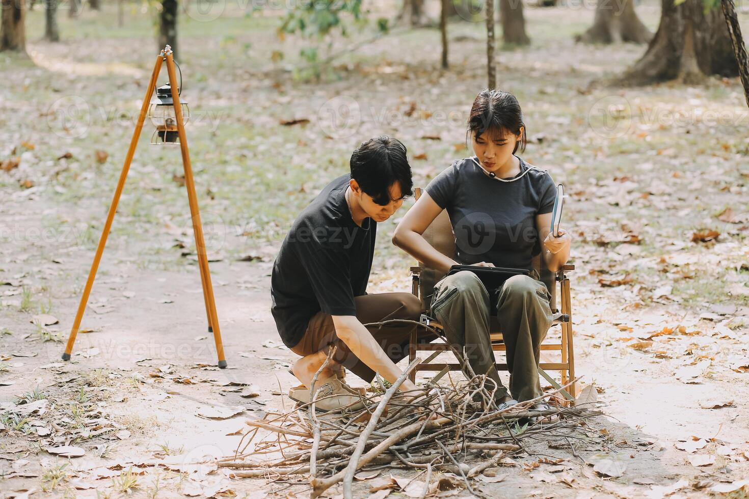 Asian couple sweet in tent inside on they camping trip, traveller relax and sleep togather in out door and camping trip photo