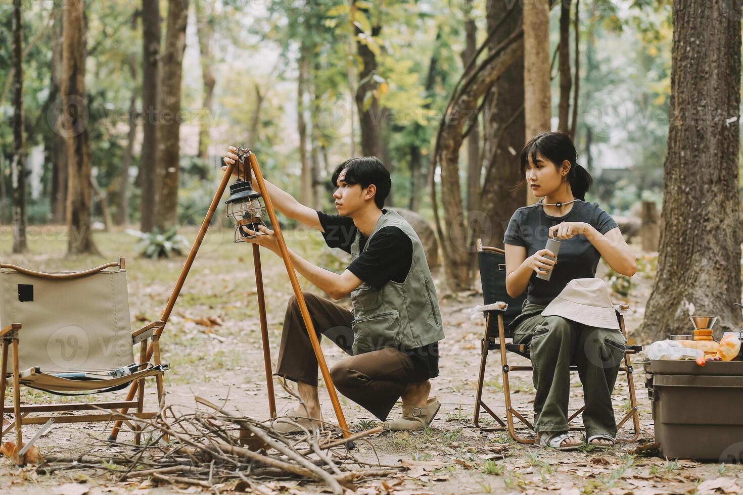 Asian couple sweet in tent inside on they camping trip, traveller relax and sleep togather in out door and camping trip photo