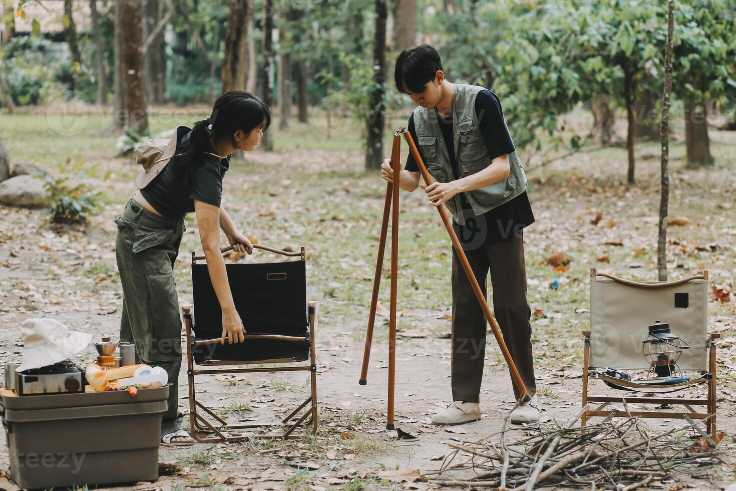 Asian couple sweet in tent inside on they camping trip, traveller relax and sleep togather in out door and camping trip photo