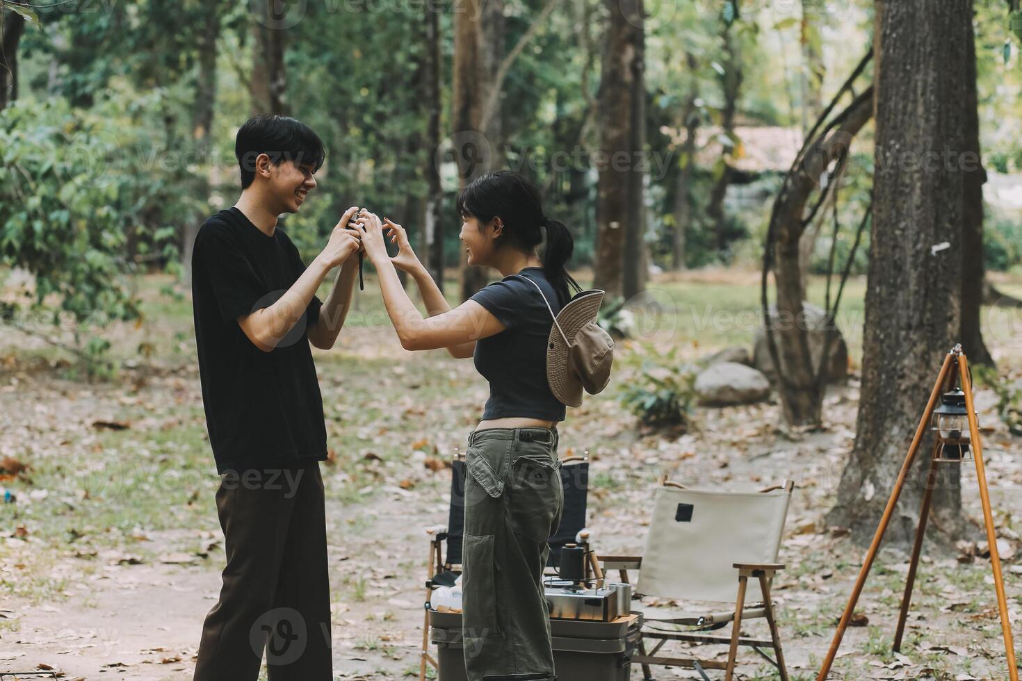 Asian couple sweet in tent inside on they camping trip, traveller relax and sleep togather in out door and camping trip photo