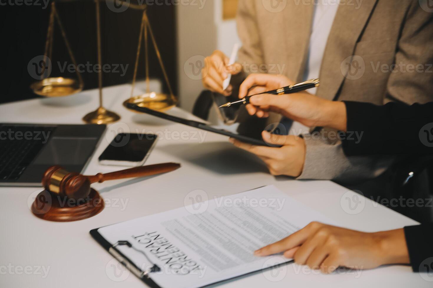 Lawyer, legal advisor, businessman brainstorming information on agreement details Business contracts in legal processing books for accuracy in contract documents. joint financial investment. photo