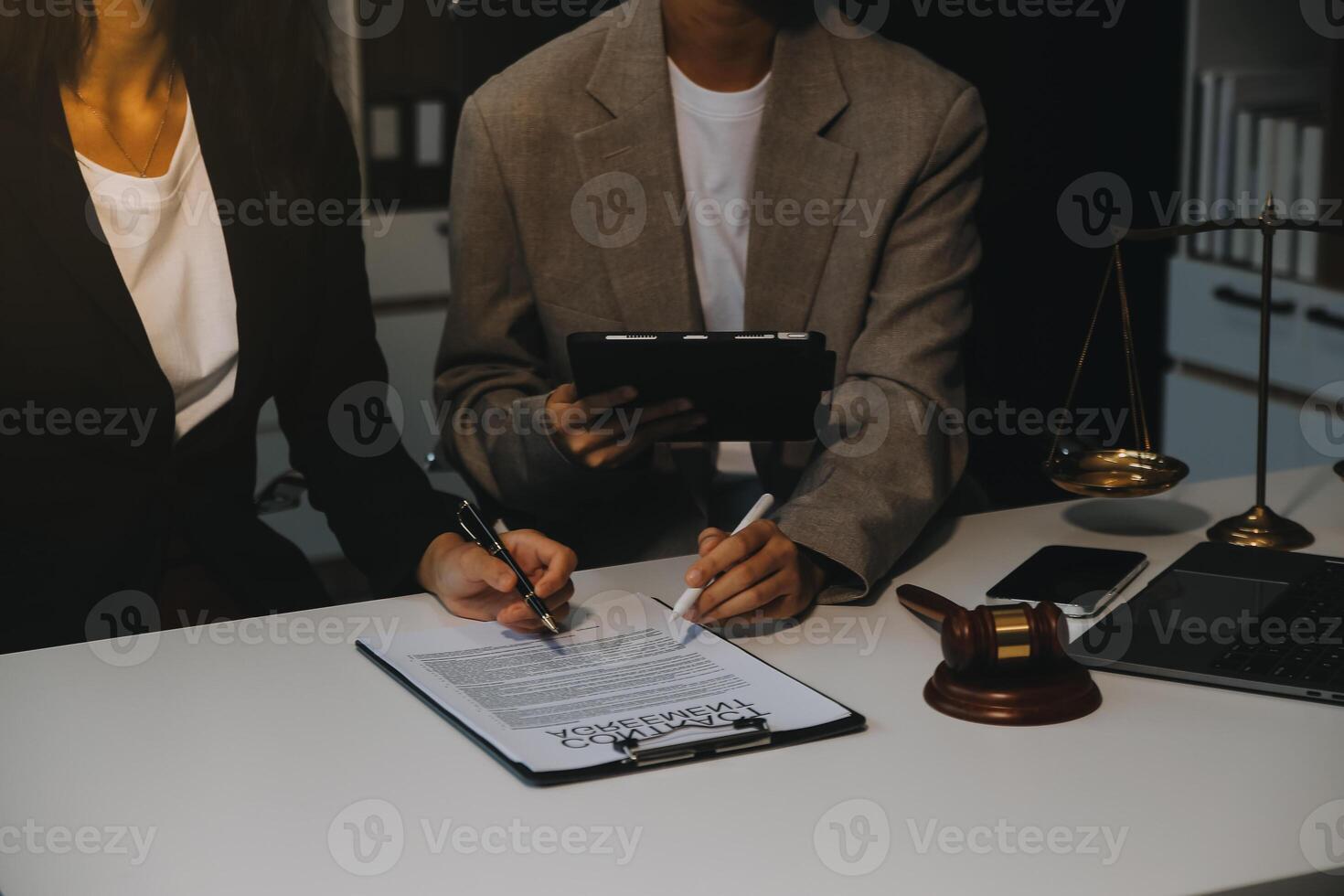 Lawyer, legal advisor, businessman brainstorming information on agreement details Business contracts in legal processing books for accuracy in contract documents. joint financial investment. photo