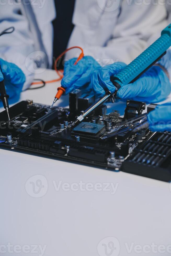 Close up of Technician measuring voltage electronic circuit board television, Service after sale fix electric equipment within insurance. photo
