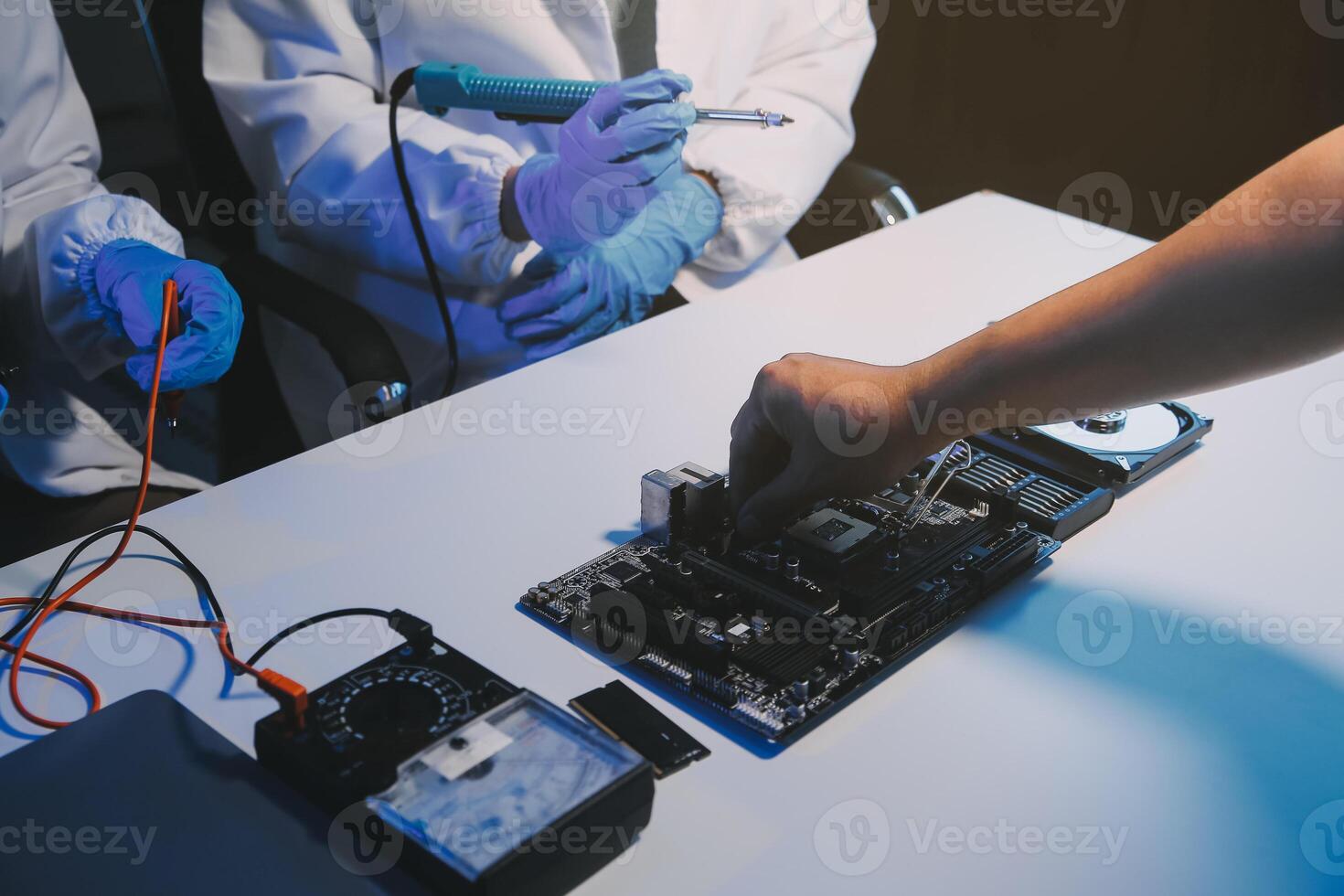 Close up of Technician measuring voltage electronic circuit board television, Service after sale fix electric equipment within insurance. photo