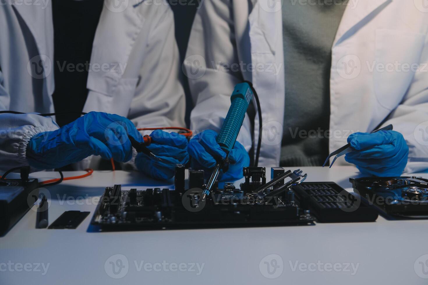 Close up of Technician measuring voltage electronic circuit board television, Service after sale fix electric equipment within insurance. photo