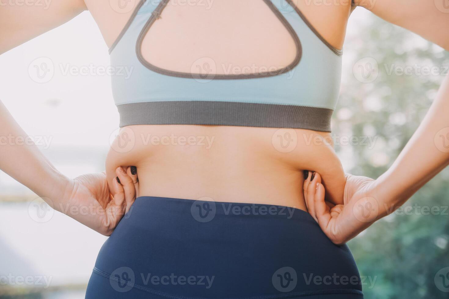 fat woman, fat belly, chubby, obese woman hand holding excessive belly fat with measure tape, woman diet lifestyle concept photo