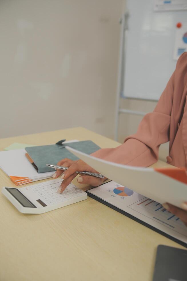 Business Documents, Auditor businesswoman checking searching document legal prepare paperwork or report for analysis TAX time,accountant Documents data contract partner deal in workplace office photo