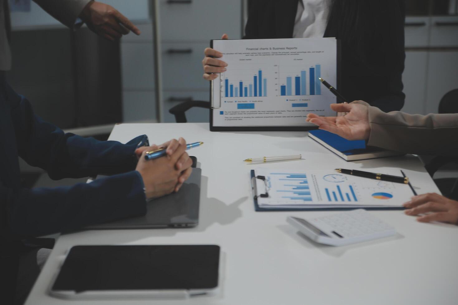 Business team collaboration discussing working analyzing with financial data and marketing growth report graph in team, presentation and brainstorming to strategy planning making profit of company. photo