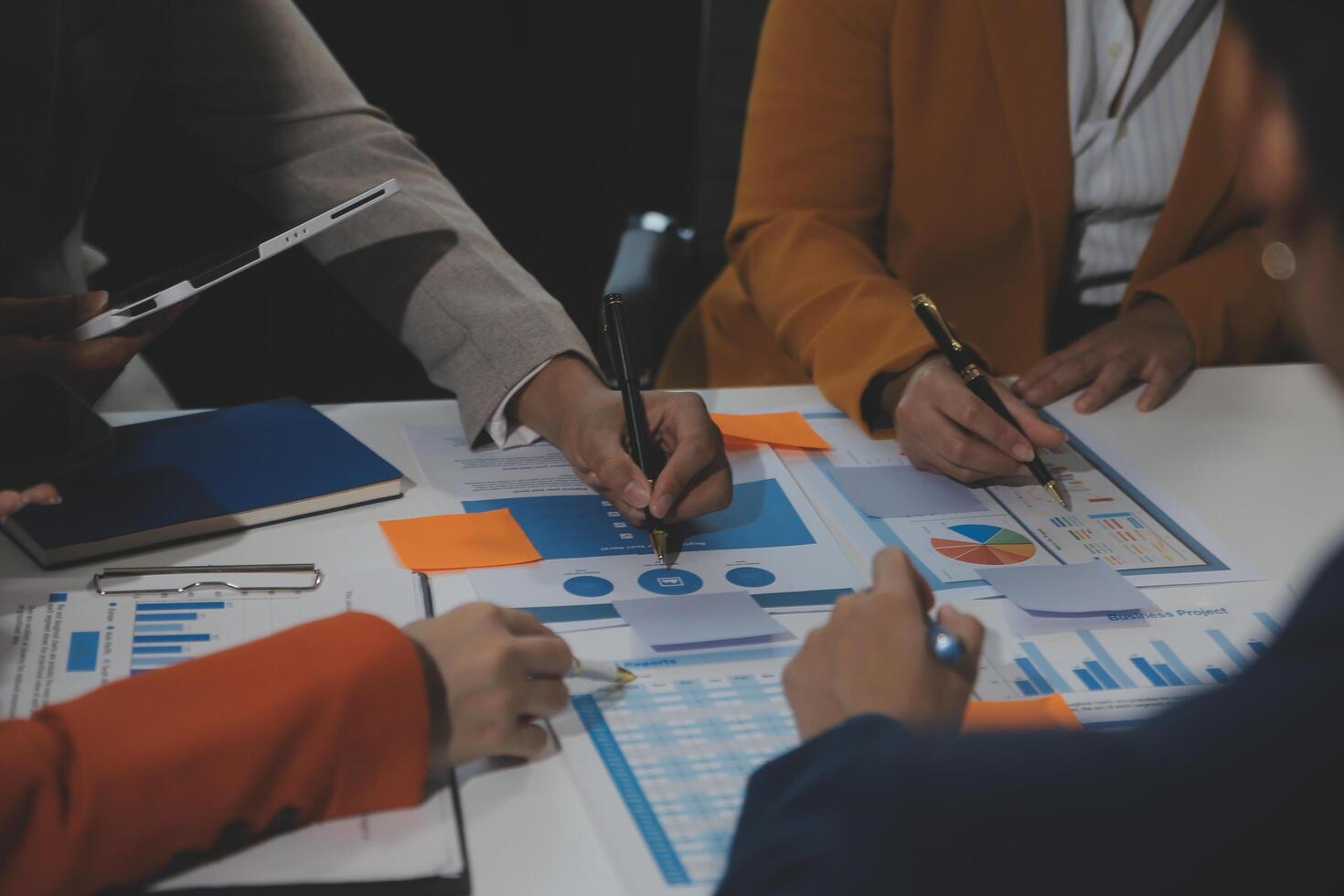 Business team collaboration discussing working analyzing with financial data and marketing growth report graph in team, presentation and brainstorming to strategy planning making profit of company. photo