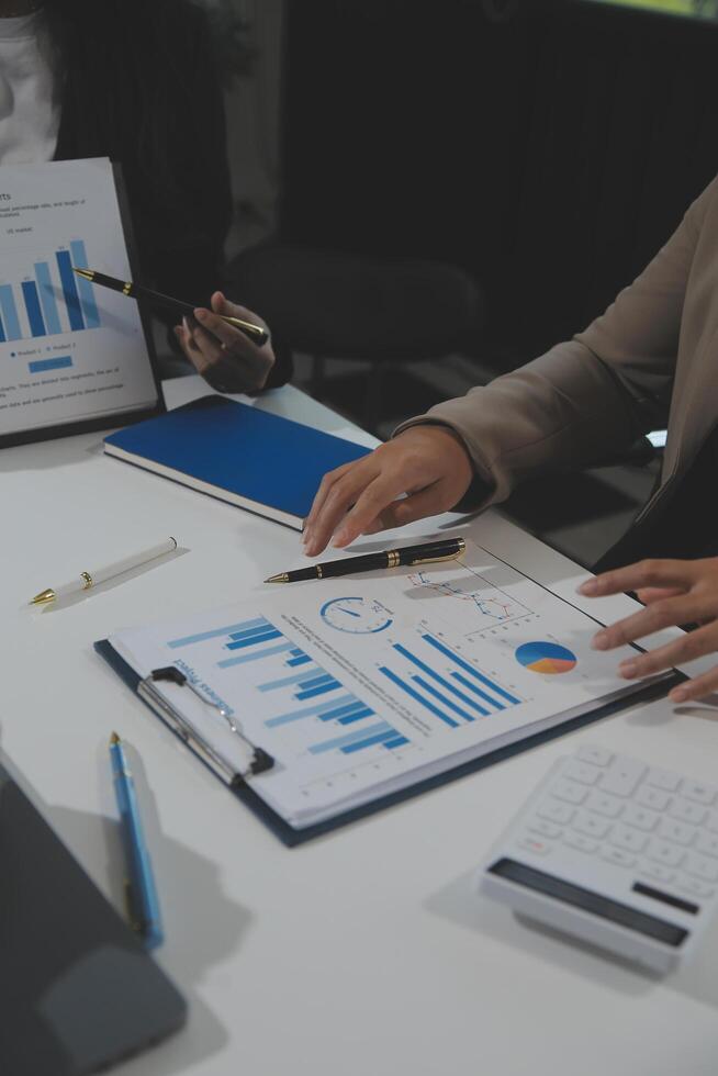 Business team collaboration discussing working analyzing with financial data and marketing growth report graph in team, presentation and brainstorming to strategy planning making profit of company. photo