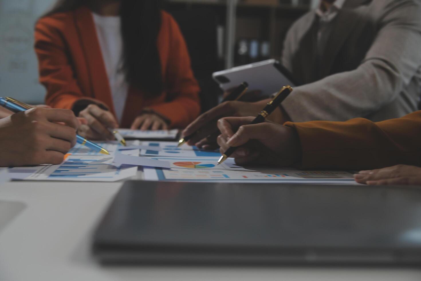 Business team collaboration discussing working analyzing with financial data and marketing growth report graph in team, presentation and brainstorming to strategy planning making profit of company. photo