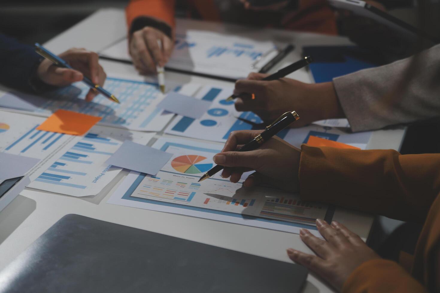 Business team collaboration discussing working analyzing with financial data and marketing growth report graph in team, presentation and brainstorming to strategy planning making profit of company. photo