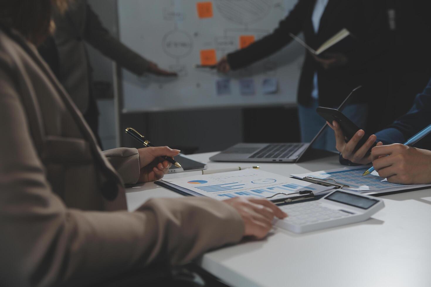 Business team collaboration discussing working analyzing with financial data and marketing growth report graph in team, presentation and brainstorming to strategy planning making profit of company. photo