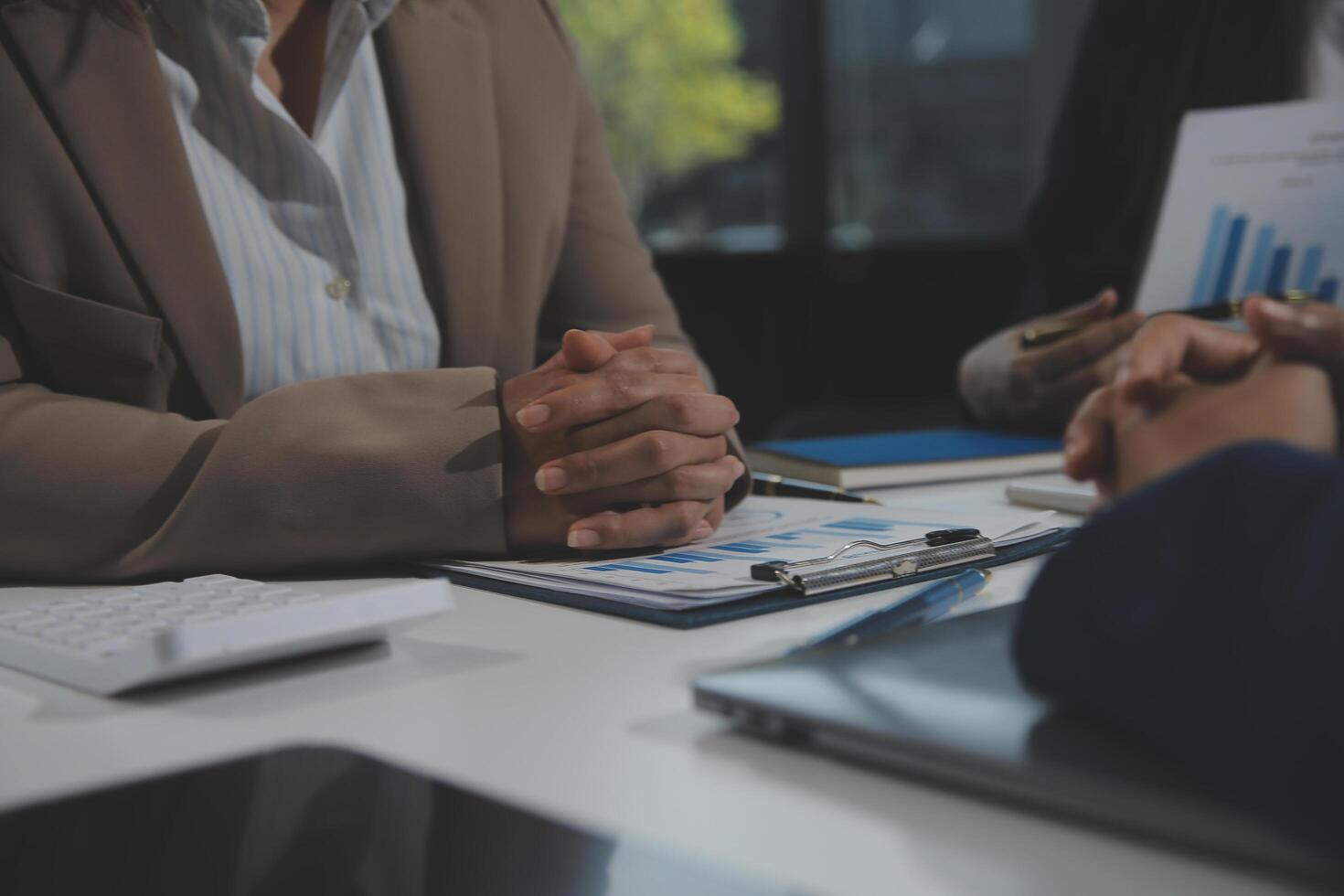 Business team collaboration discussing working analyzing with financial data and marketing growth report graph in team, presentation and brainstorming to strategy planning making profit of company. photo