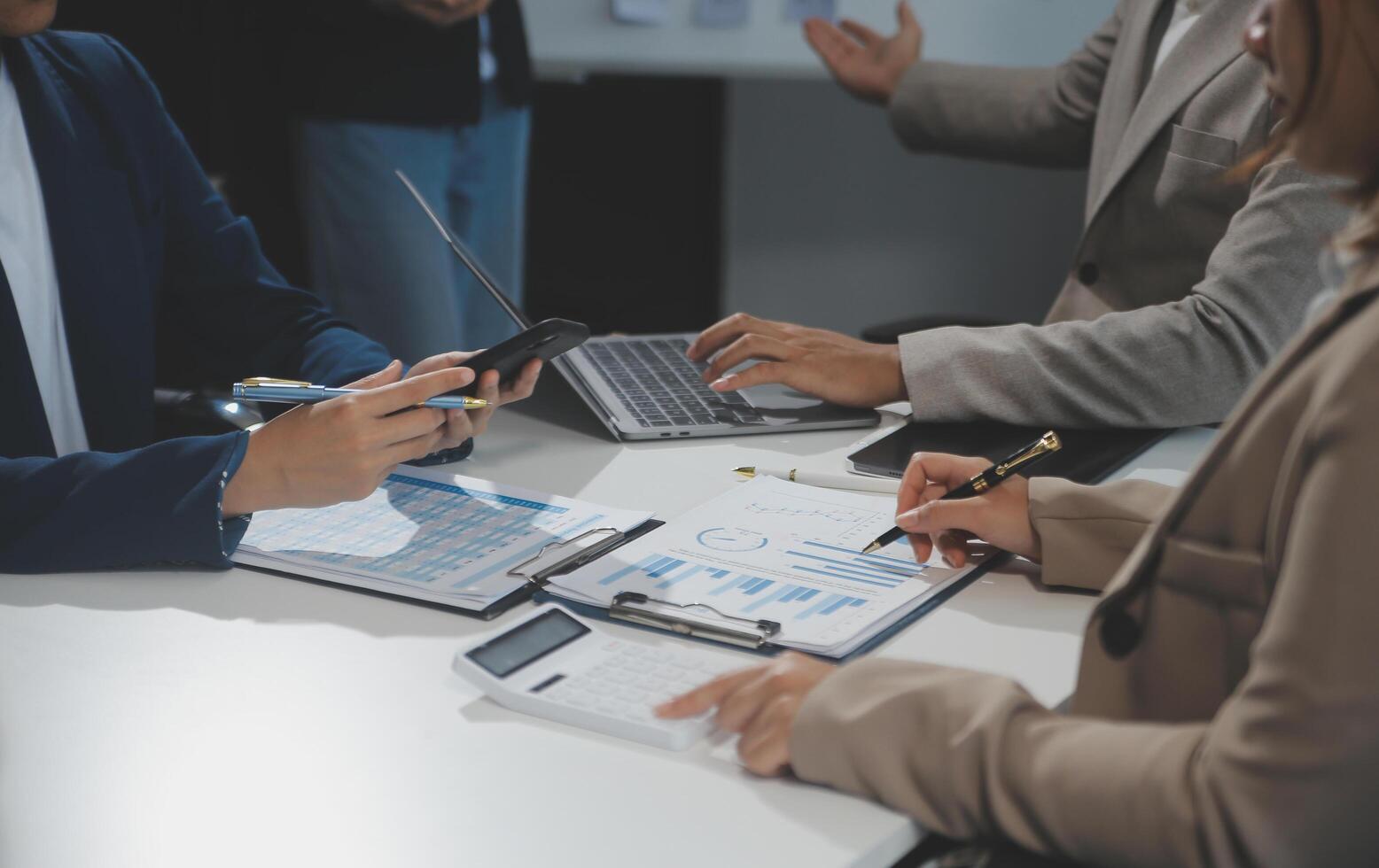 Business team collaboration discussing working analyzing with financial data and marketing growth report graph in team, presentation and brainstorming to strategy planning making profit of company. photo