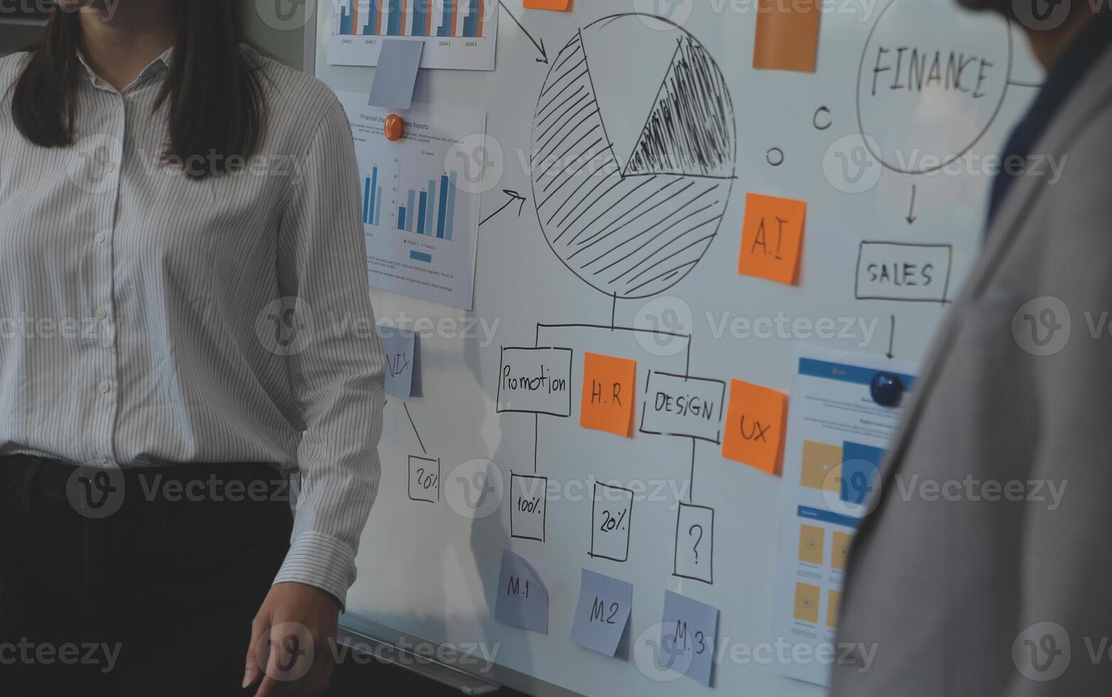 Financial analysts analyze business financial reports on a digital tablet planning investment project during a discussion at a meeting of corporate showing the results of their successful teamwork. photo