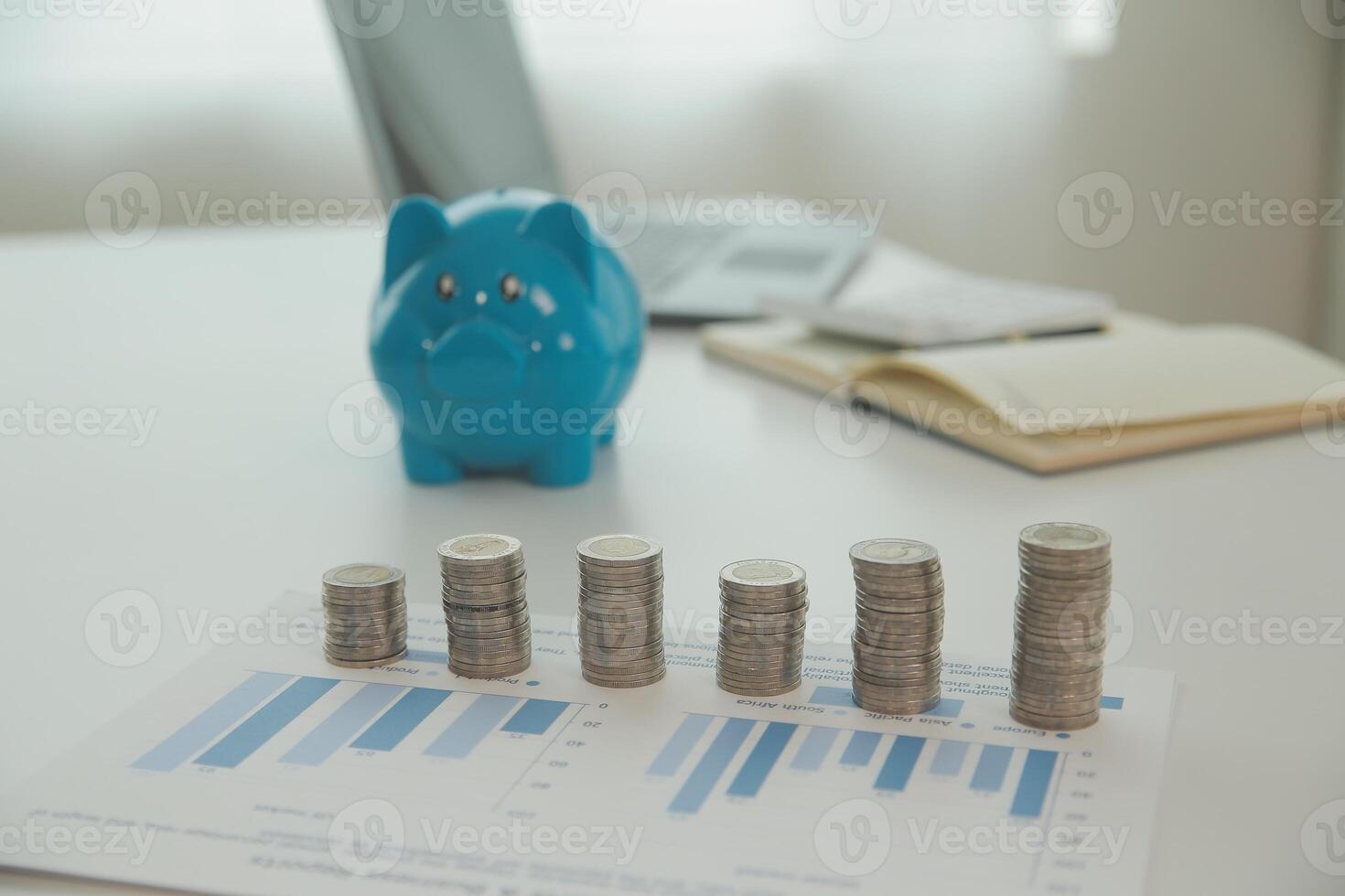 Saving money wealth concept, asian young business woman hand write management budget for saving cost, cash finance planning to spend enough money on her income for save money, payment tax, investing. photo