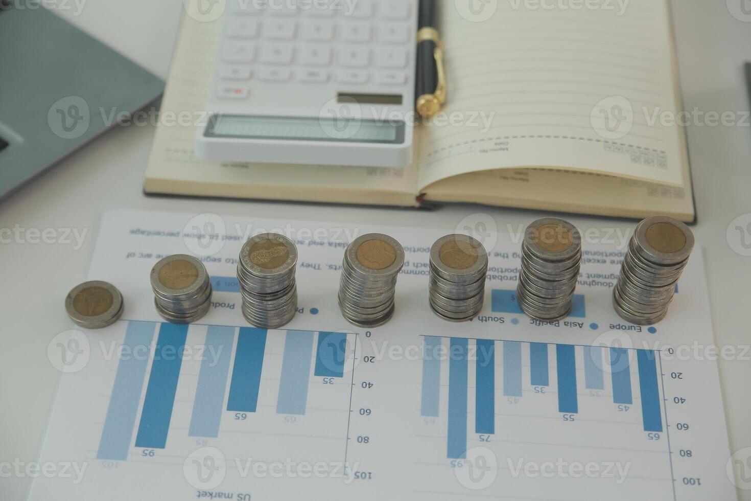 Saving money wealth concept, asian young business woman hand write management budget for saving cost, cash finance planning to spend enough money on her income for save money, payment tax, investing. photo