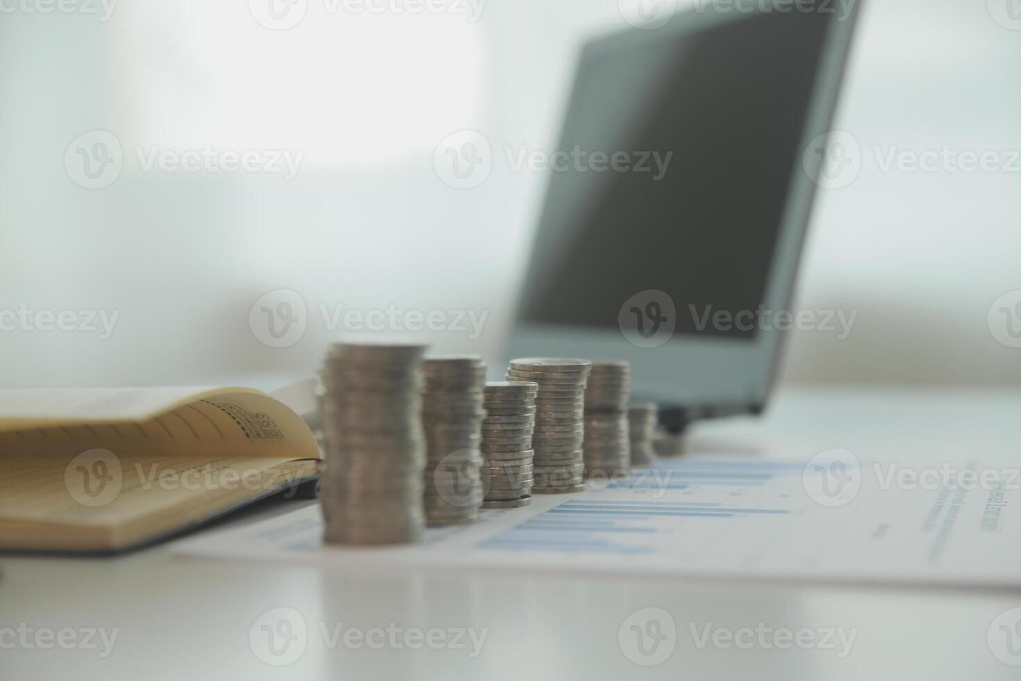 Saving money wealth concept, asian young business woman hand write management budget for saving cost, cash finance planning to spend enough money on her income for save money, payment tax, investing. photo