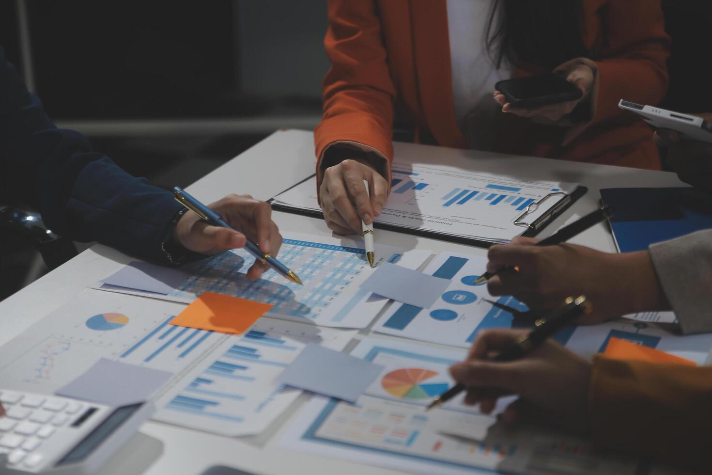 Business team collaboration discussing working analyzing with financial data and marketing growth report graph in team, presentation and brainstorming to strategy planning making profit of company. photo