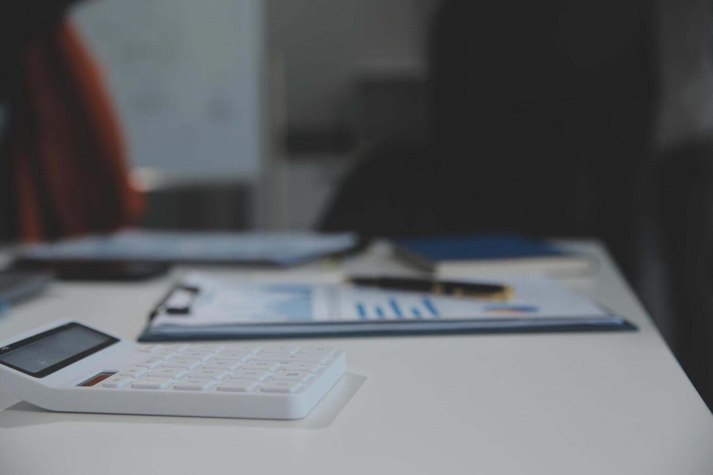 Business team collaboration discussing working analyzing with financial data and marketing growth report graph in team, presentation and brainstorming to strategy planning making profit of company. photo