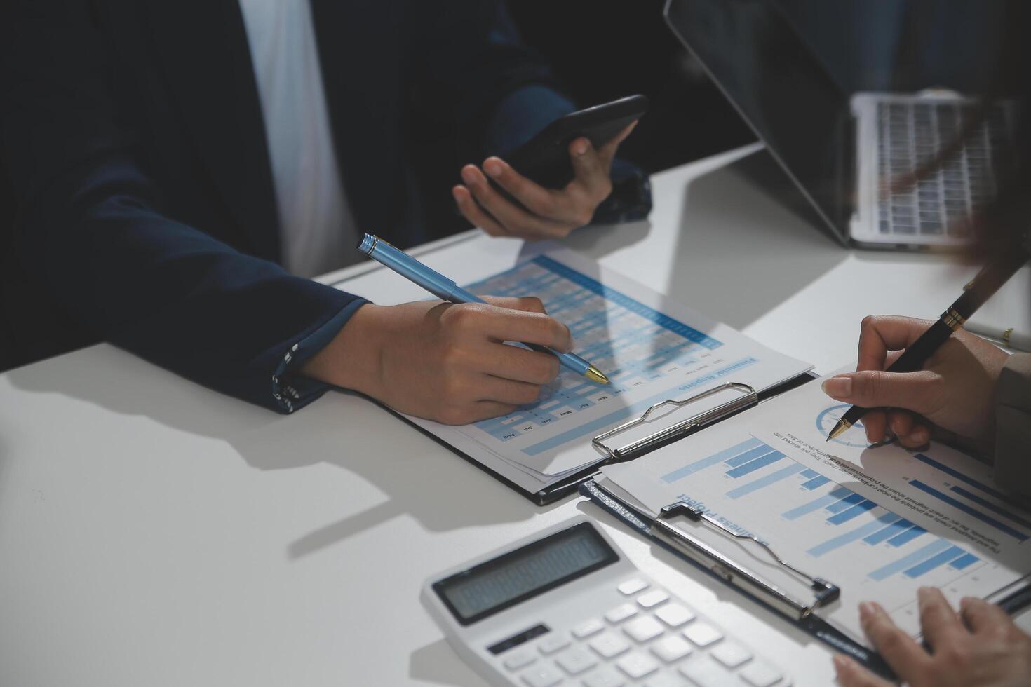 Business team collaboration discussing working analyzing with financial data and marketing growth report graph in team, presentation and brainstorming to strategy planning making profit of company. photo