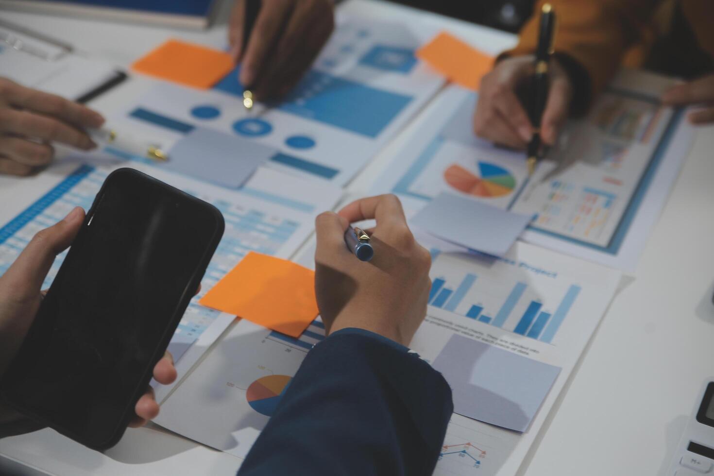 Business team collaboration discussing working analyzing with financial data and marketing growth report graph in team, presentation and brainstorming to strategy planning making profit of company. photo
