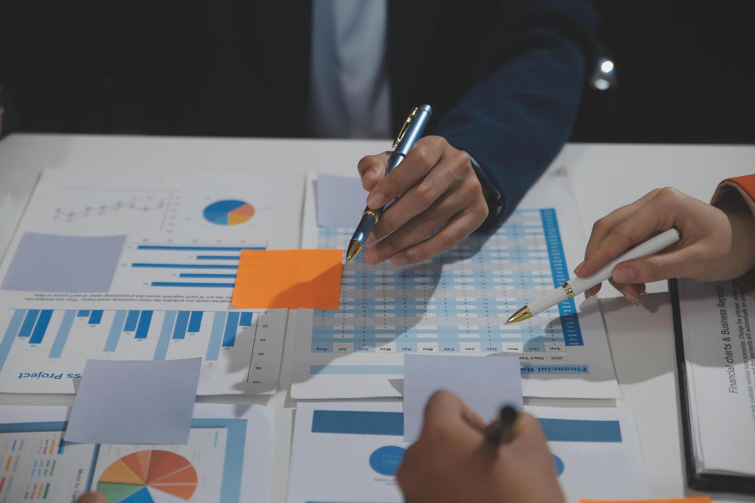 Business team collaboration discussing working analyzing with financial data and marketing growth report graph in team, presentation and brainstorming to strategy planning making profit of company. photo